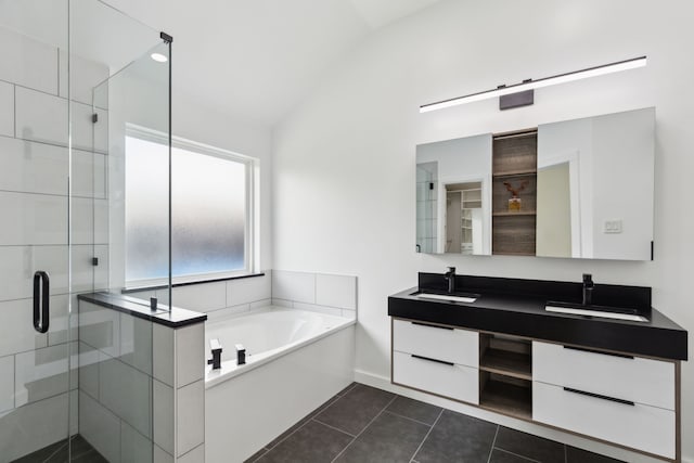 826 Ashley Pl, Mesquite, TX 75181 - full bathroom featuring double vanity, a stall shower, a garden tub, tile patterned floors, and lofted ceiling