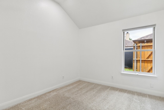 826 Ashley Pl, Mesquite, TX 75181 - unfurnished room featuring light colored carpet, baseboards, and lofted ceiling