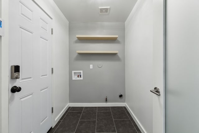 826 Ashley Pl, Mesquite, TX 75181 - laundry room featuring hookup for a gas dryer, dark tile patterned flooring, baseboards, washer hookup, and electric dryer hookup