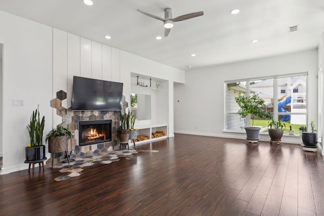 826 Ashley Pl, Mesquite, TX 75181 - living room with dark wood-style flooring, a ceiling fan, a fireplace, baseboards, and recessed lighting