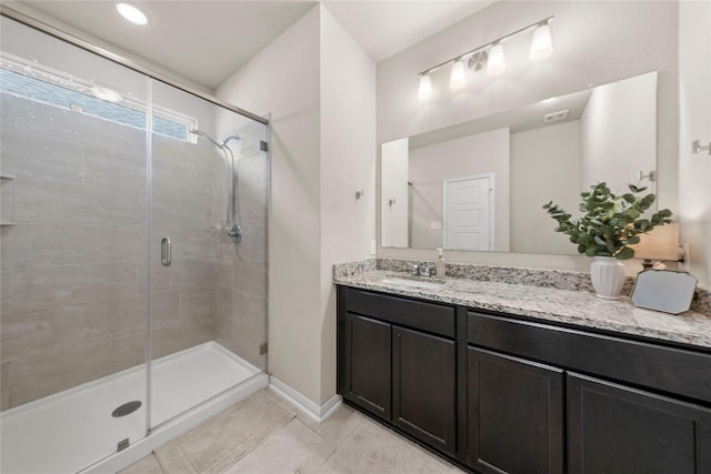 1512 Elise Ave, Waco, TX 76706 - bathroom featuring a shower stall, tile patterned flooring, vanity, and baseboards