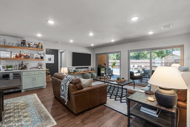 1617 Versailles Dr, Richardson, TX 75081 - living room featuring wine cooler, a bar, recessed lighting, and dark wood-style floors