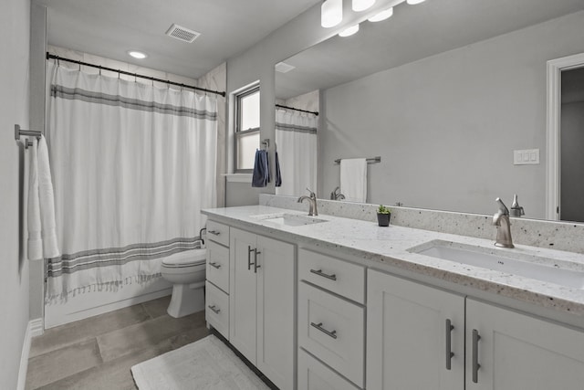 1617 Versailles Dr, Richardson, TX 75081 - full bath with toilet, double vanity, and tile patterned flooring