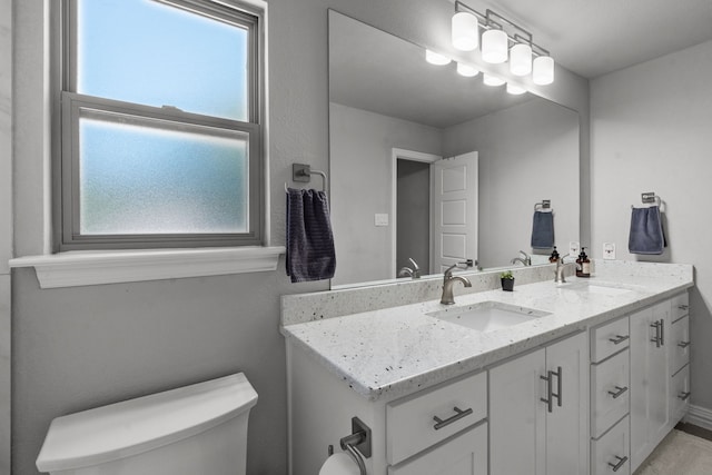 1617 Versailles Dr, Richardson, TX 75081 - bathroom featuring toilet and vanity