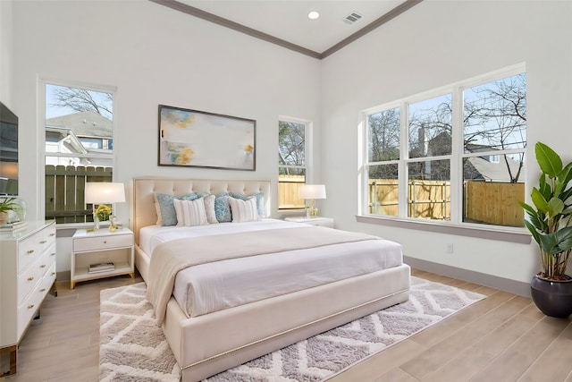 840 Northwood Rd, Fort Worth, TX 76107 - bedroom with crown molding, light wood finished floors, and baseboards