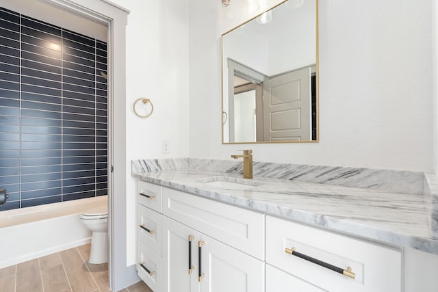 840 Northwood Rd, Fort Worth, TX 76107 - full bathroom with toilet, vanity, wood finished floors, and washtub / shower combination