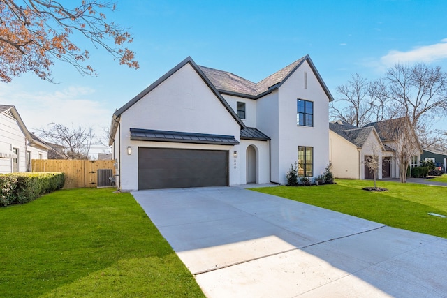 840 Northwood Rd, Fort Worth, TX 76107 - view of front of house with a standing seam roof, driveway, central air condition unit, and metal roof
