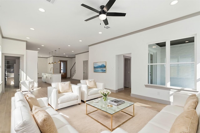 840 Northwood Rd, Fort Worth, TX 76107 - living room with recessed lighting, ornamental molding, light wood finished floors, stairway, and baseboards