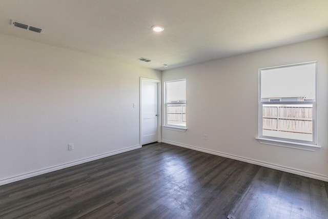 7717 Vineyard Dr, Abilene, TX 79606 - spare room featuring dark wood-type flooring and baseboards