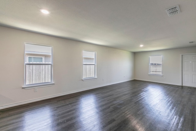 7717 Vineyard Dr, Abilene, TX 79606 - empty room featuring baseboards, dark wood-type flooring, and recessed lighting