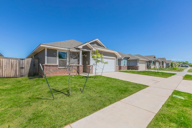 7717 Vineyard Dr, Abilene, TX 79606 - view of front of property with brick siding, concrete driveway, and an attached garage