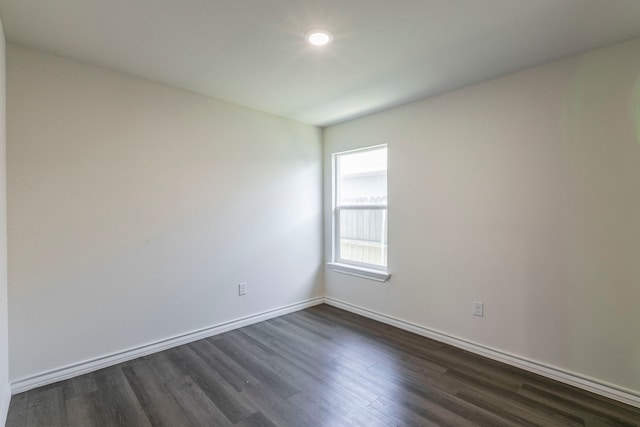 7717 Vineyard Dr, Abilene, TX 79606 - spare room with dark wood-style floors and baseboards