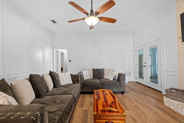 1610 Alpine Pass, Lewisville, TX 75077 - living room with a decorative wall, light wood-type flooring, and ceiling fan