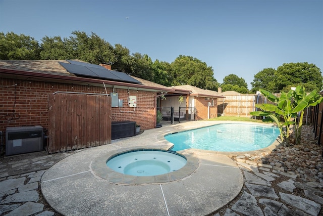 1610 Alpine Pass, Lewisville, TX 75077 - view of pool featuring a fenced backyard, a pool with connected hot tub, and a patio