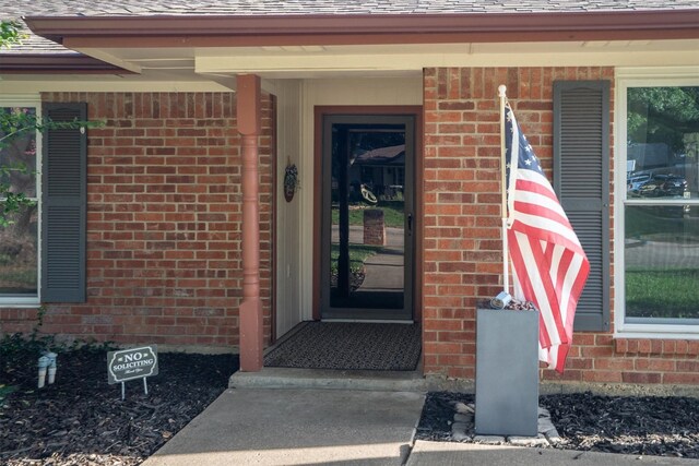1610 Alpine Pass, Lewisville, TX 75077 - property entrance featuring brick siding