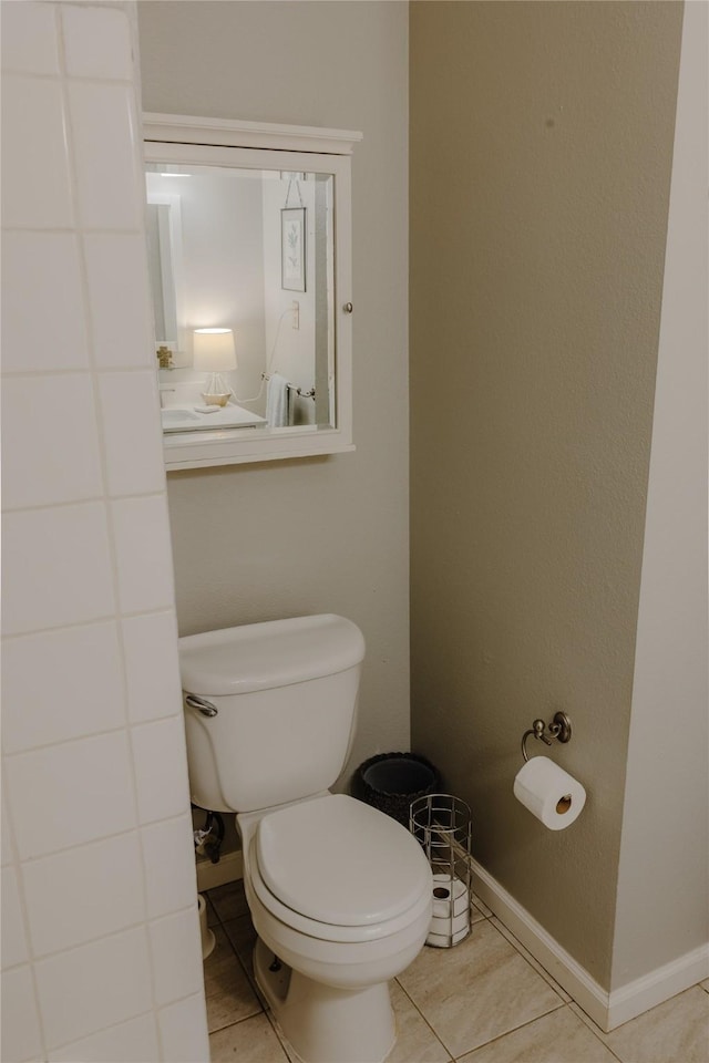 2712 Larkin Ave, Fort Worth, TX 76133 - bathroom with toilet, tile patterned floors, and baseboards