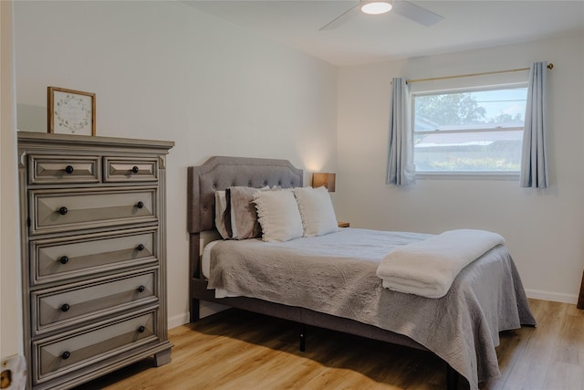 2712 Larkin Ave, Fort Worth, TX 76133 - bedroom with light wood finished floors, a ceiling fan, and baseboards