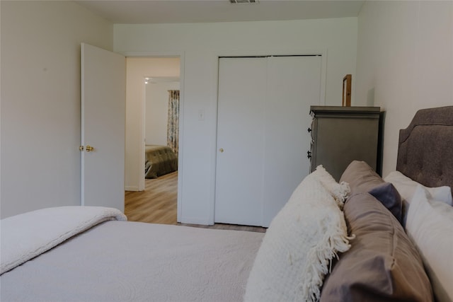 2712 Larkin Ave, Fort Worth, TX 76133 - bedroom with wood finished floors, a closet, and baseboards