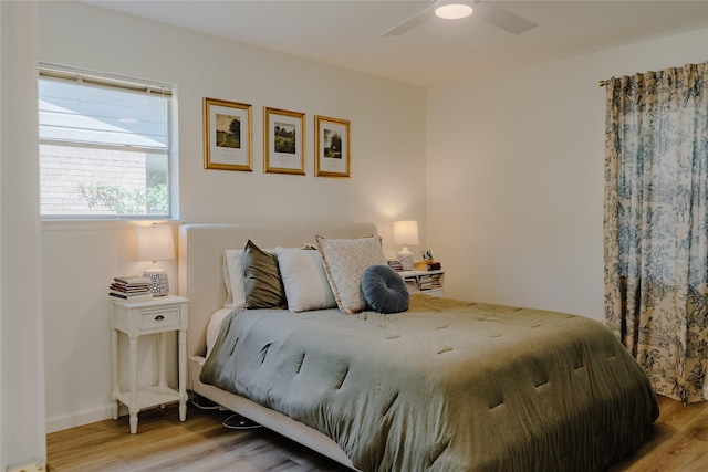 2712 Larkin Ave, Fort Worth, TX 76133 - bedroom featuring wood finished floors, a ceiling fan, and baseboards