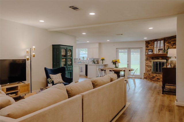 2712 Larkin Ave, Fort Worth, TX 76133 - living area featuring light wood-style floors, recessed lighting, and a fireplace