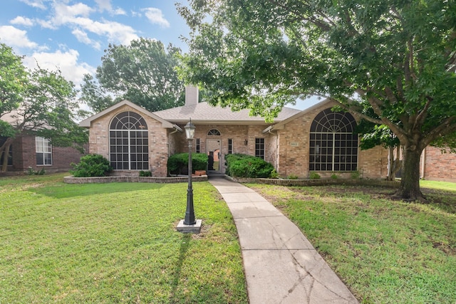 2510 High Pointe Blvd, Mckinney, TX 75071 - view of front of house featuring a front yard, a chimney, and brick siding