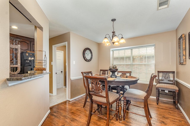 2510 High Pointe Blvd, Mckinney, TX 75071 - dining room with light wood-style flooring and a chandelier