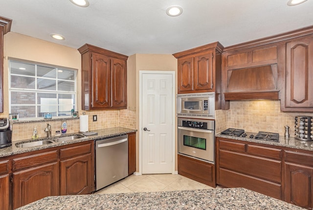 2510 High Pointe Blvd, Mckinney, TX 75071 - kitchen featuring stainless steel appliances, premium range hood, light stone counters, decorative backsplash, and recessed lighting