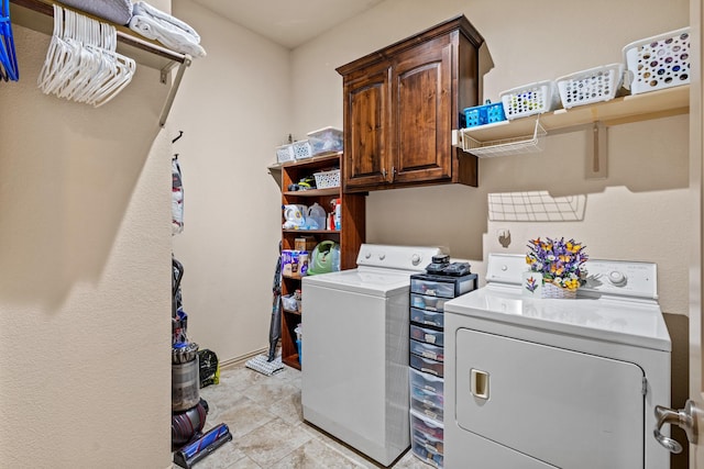 2508 Pioneer Dr, Denton, TX 76210 - laundry room with washing machine and dryer, cabinet space, and light tile patterned flooring