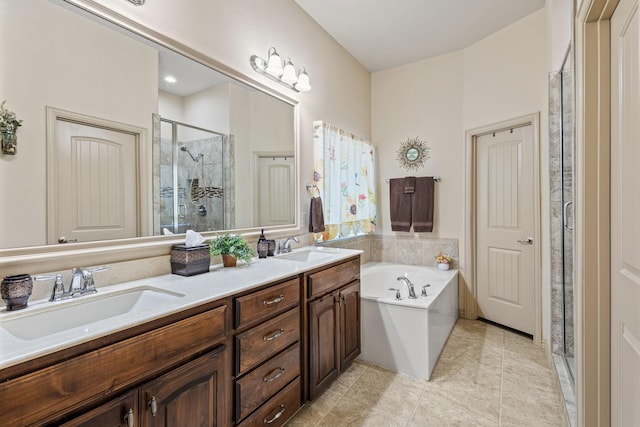 2508 Pioneer Dr, Denton, TX 76210 - bathroom featuring a stall shower, a bath, double vanity, and tile patterned flooring