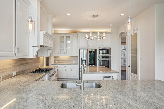 4534 Whispering Lake Dr, Frisco, TX 75036 - unfurnished dining area with arched walkways, wood finished floors, baseboards, stairs, and ornamental molding