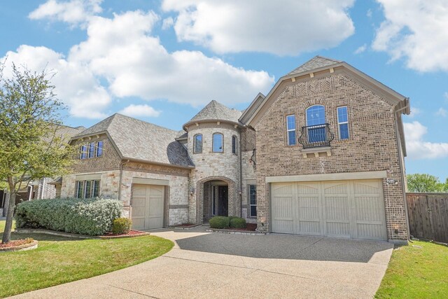 4534 Whispering Lake Dr, Frisco, TX 75036 - living room featuring a ceiling fan, a towering ceiling, a fireplace, wood finished floors, and built in shelves