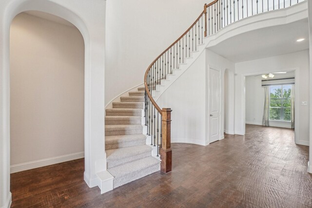 4534 Whispering Lake Dr, Frisco, TX 75036 - living area featuring baseboards, light wood finished floors, and a towering ceiling