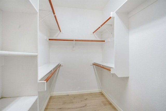 8393 Davis Dr, Frisco, TX 75036 - walk in closet featuring light wood-style floors