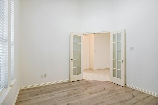 8393 Davis Dr, Frisco, TX 75036 - empty room featuring french doors and wood finished floors