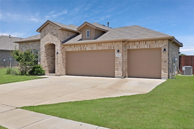 1099 Admiral Dr, Azle, TX 76020 - french provincial home with a garage, concrete driveway, and brick siding