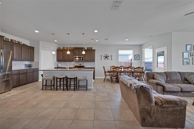 1099 Admiral Dr, Azle, TX 76020 - living area featuring light tile patterned floors and recessed lighting