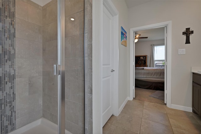 1099 Admiral Dr, Azle, TX 76020 - ensuite bathroom featuring vanity, a stall shower, a ceiling fan, and tile patterned flooring