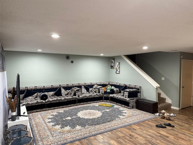 501 Towne House Ln, Richardson, TX 75081 - living room featuring wood finished floors, recessed lighting, stairway, and a textured ceiling