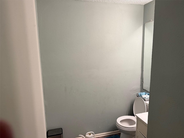 501 Towne House Ln, Richardson, TX 75081 - half bathroom featuring toilet and vanity