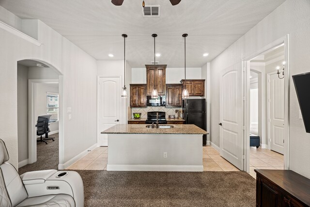 1412 Siena Ln, Rockwall, TX 75032 - kitchen featuring black appliances, a ceiling fan, arched walkways, light tile patterned flooring, and recessed lighting