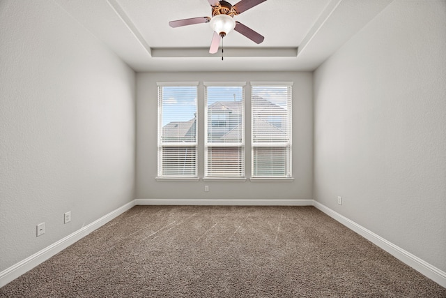 1412 Siena Ln, Rockwall, TX 75032 - empty room featuring ceiling fan, carpet, baseboards, a raised ceiling, and a textured wall