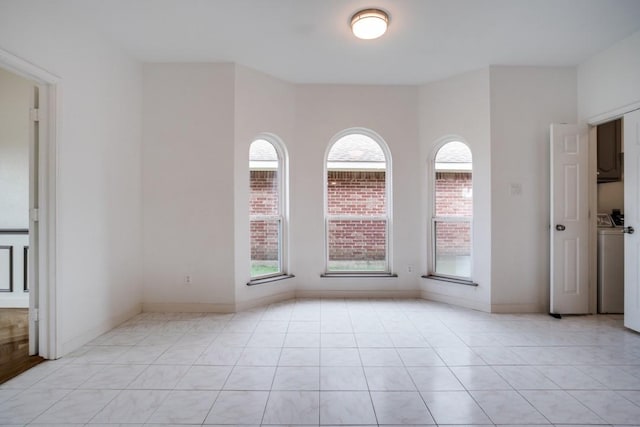 1467 Norfolk Ct, Allen, TX 75002 - spare room with light tile patterned flooring, washer / clothes dryer, and baseboards