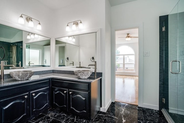 1467 Norfolk Ct, Allen, TX 75002 - bathroom featuring marble finish floors, double vanity, a stall shower, and baseboards