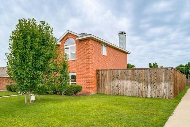1467 Norfolk Ct, Allen, TX 75002 - view of property exterior with a chimney, brick siding, and a lawn