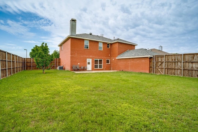 1467 Norfolk Ct, Allen, TX 75002 - back of house featuring central air condition unit, brick siding, a chimney, and a patio