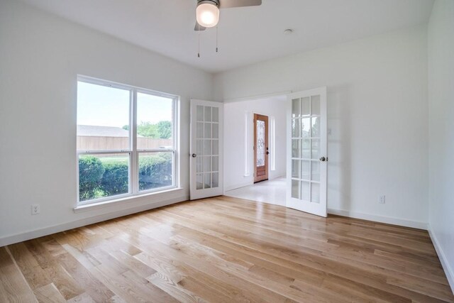 1467 Norfolk Ct, Allen, TX 75002 - empty room with french doors, a ceiling fan, plenty of natural light, and wood finished floors