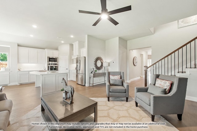 2503 Jennifer Ln, Mansfield, TX 76063 - living area featuring light wood finished floors, a ceiling fan, recessed lighting, stairs, and vaulted ceiling