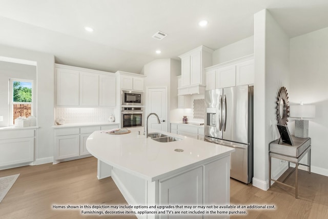 2503 Jennifer Ln, Mansfield, TX 76063 - kitchen with appliances with stainless steel finishes, a sink, white cabinetry, decorative backsplash, and recessed lighting