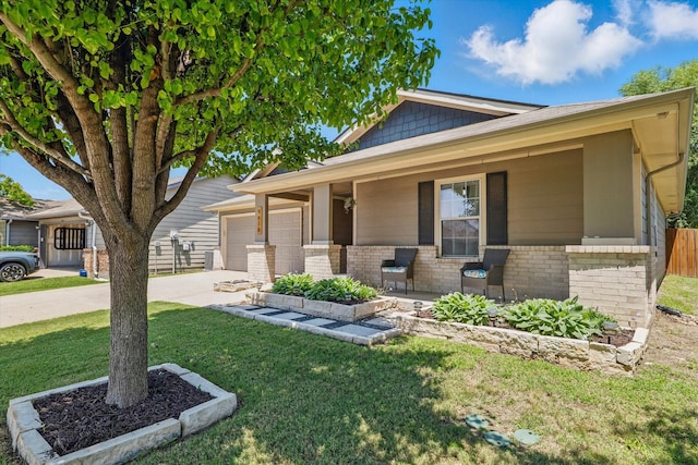 9616 George Bush Dr, Mckinney, TX 75072 - view of front of property with a porch, a garage, driveway, and brick siding