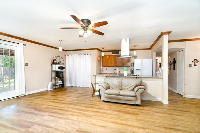 1502 Santa Fe Trl, Grand Prairie, TX 75052 - living room with baseboards, ceiling fan, ornamental molding, and light wood-type flooring